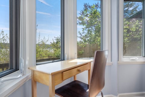 Small desk in lower bedroom for dedicated workspace.