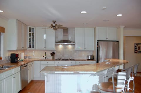 Open kitchen dining and living room invites opportunities for shared meal time.