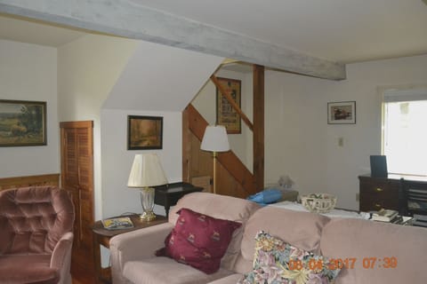 Comfy Couch in front of brick firelplace