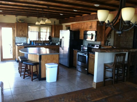 Gourmet kitchen with island and new stainless steel appliances