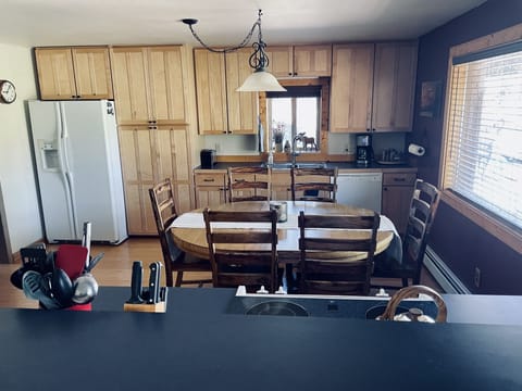 Kitchen -  adding 2 table leaves seats up to 8-10, with seating for 3 at counter