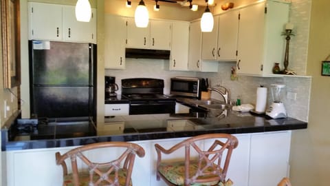 Full size kitchen is well stocked. 