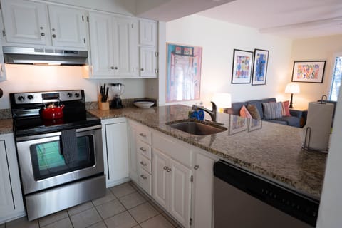 Kitchen is bright and overlooks the living area