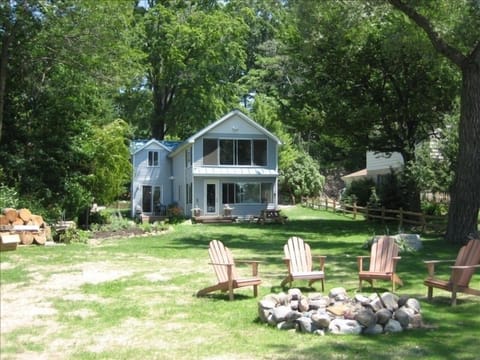 Lake side of house, with fire pit.