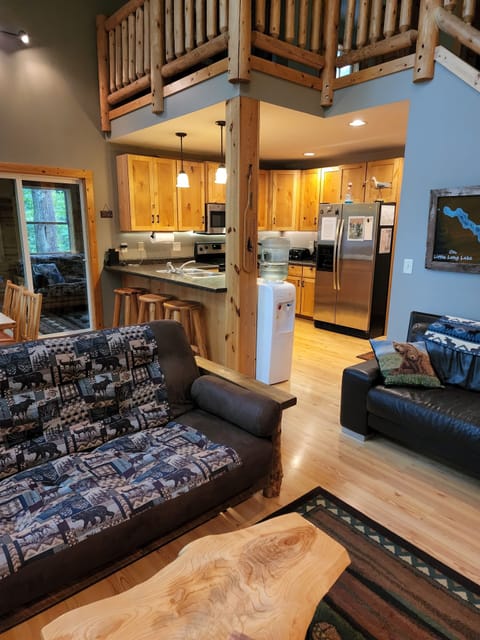open floor plan to kitchen with breakfast bar seating