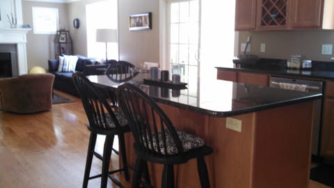 in kitchen looking at island and main living space