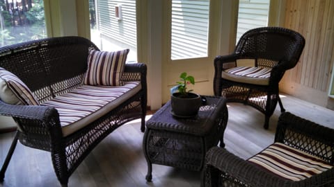 view of screened in porch sitting area
