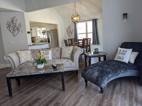 Expansive View of the Living Room and Dining Room area with entry to the Kitchen