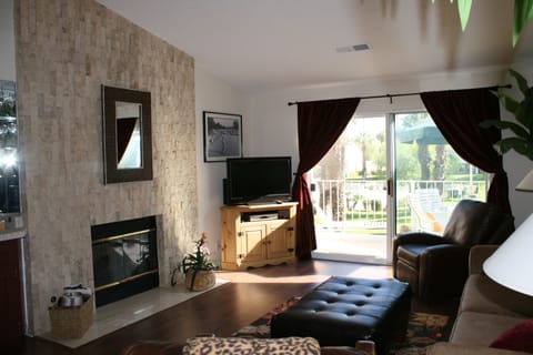 Living room with view of pool and grounds