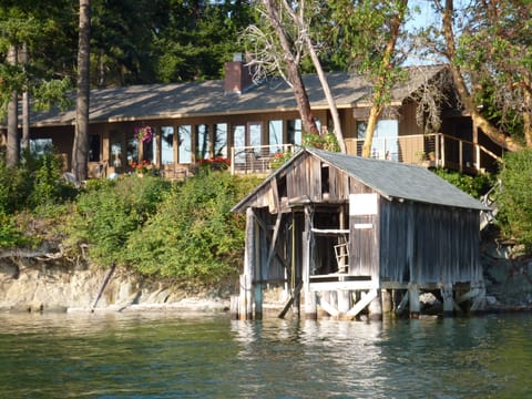 Vintage boathouse sets off architecture of  classic Northwest Contemporary house