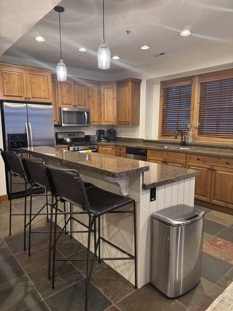 The kitchen island has seating for 3