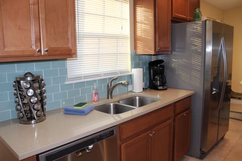 Pretty kitchen with solid surface counters & Stainless appliances