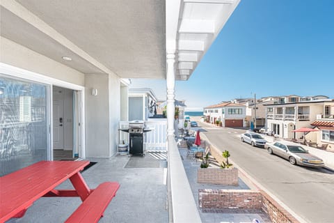 Ocean views and breezes can be enjoyed from the second level front balcony, with outdoor dining, extra seating and propane BBQ grill.
                