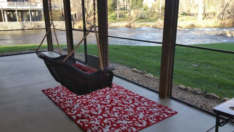 Wicker swing with outstanding views of the Chattahoochee River. 