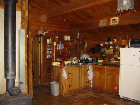 Fully-equipped kitchen area, with two-burner stove and small convection oven.