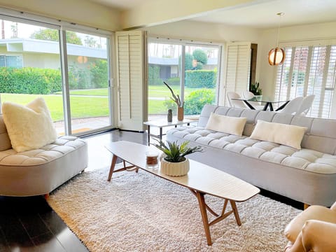 Living room space with a sweeping view of the outdoor landscape.
