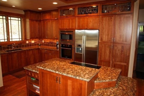 Kitchen:  SS Bosch appliances, granite counter with cooktop in island