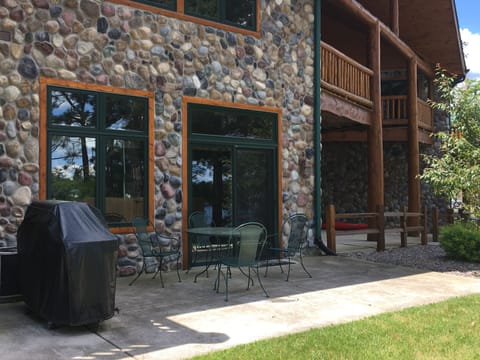 Weber Genesis gas grill located just outside the living room patio door.