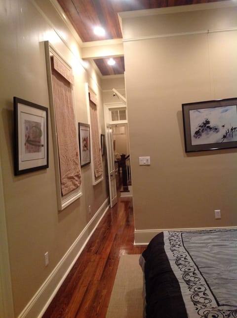 Hallway leading to walk in closet and master bathroom