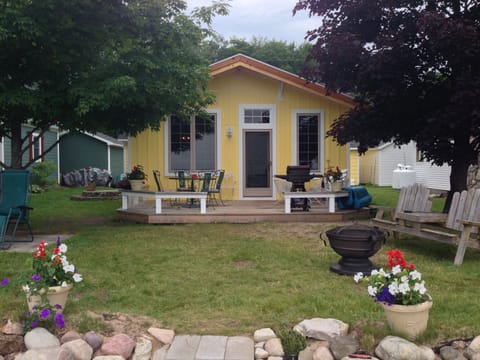 Cheery yellow cabin-cute, clean, charming inside & out, great spot for campfires