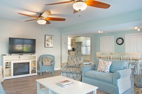 Sunroom with seating, tv and dining