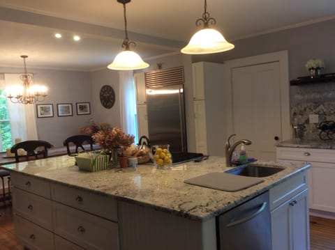 Kitchen with door leading to 1/2 bath
