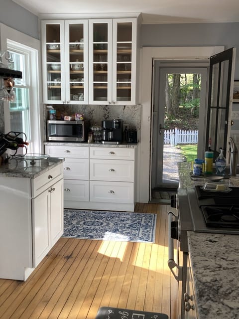 Kitchen view that includes microwave, coffee maker and toaster.