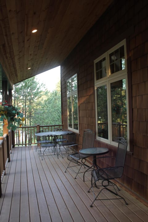 Front covered deck with seating for 6.