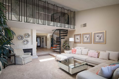 Spacious living area with beautiful natural light and plenty of seating.
