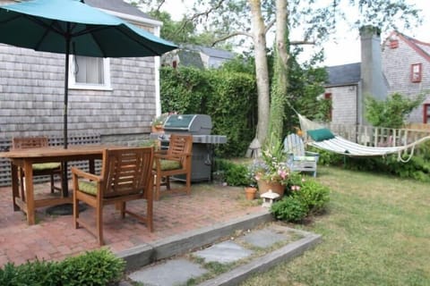 One of two patio(s);  gas grill and teak patio furniture.
