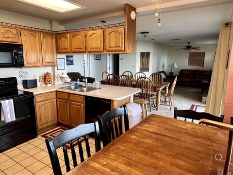 View of kitchen with table that seats 4-6