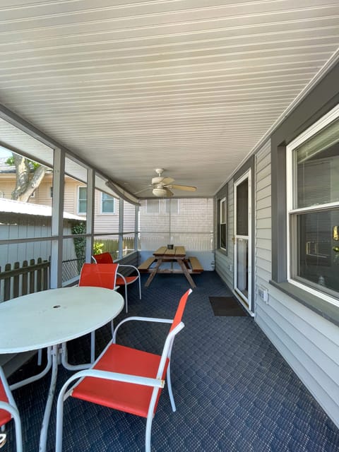 Screen porch, perfect for games, meals, and drinks!