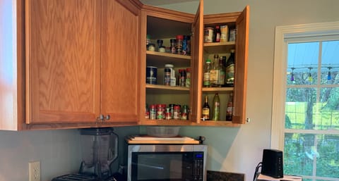 Our spices cupboard with vinegars and oils will make your packing a breeze!