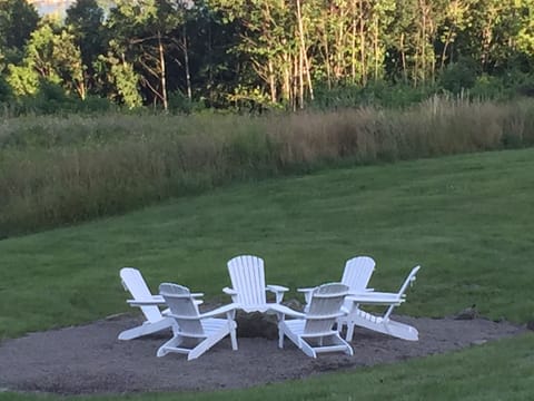 Sky watching and drinks by a cozy camp fire. S'mores anyone? Firewood provided!
