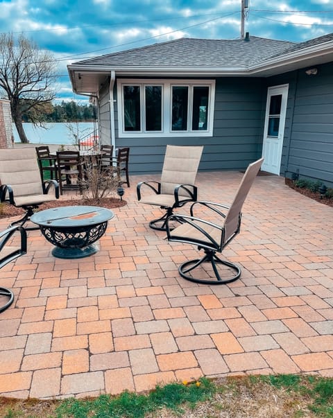 Back patio - lake views! Fire pit plus outdoor dining table (4 chairs each)