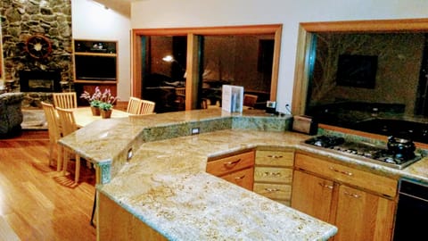 view from Kitchen to the living room fireplace and entertainment center