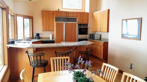 Kitchen with breakfast bar, double ovens and  large refrigerator