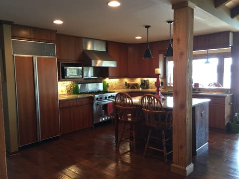 Kitchen with island and bar seating