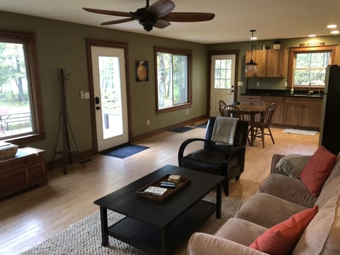 Living and kitchen space.  All windows face the lake where the moon rises.