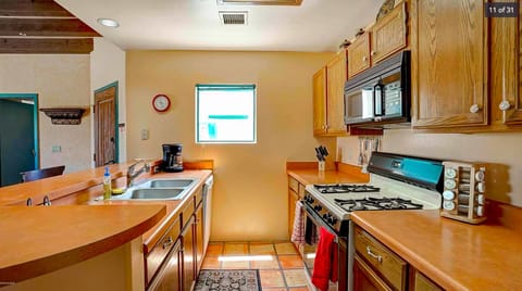 Gas range kitchen with dishwasher and microwave