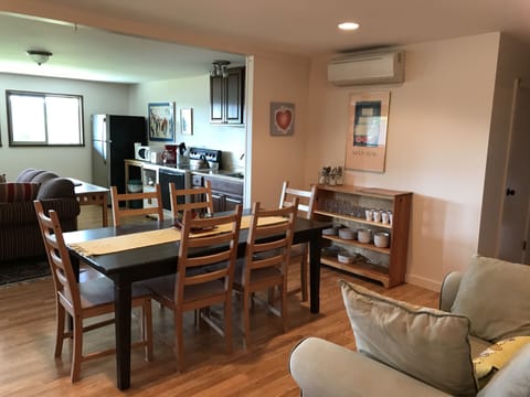 An open floor plan encompasses the living, dining, and kitchen areas. 