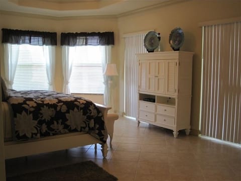 master bedroom..
Doors on either side of armoire lead on to patio.