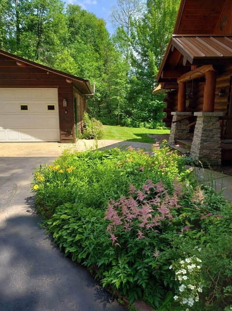 Two car garage which guests can fit one car in.