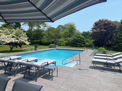 Park-like setting on over an acre of lush mature trees and specimen plants