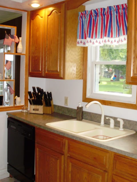 Kitchen. Shows dishwasher and knife sets.