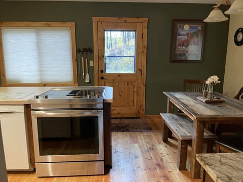 Back door to large yard and ski mountain trails