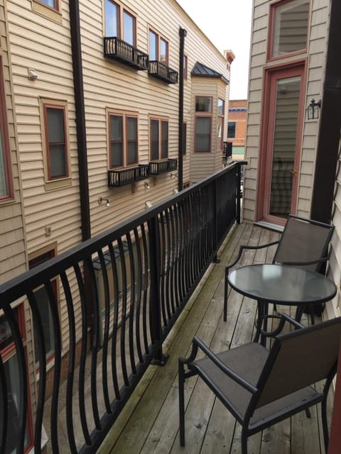 Balcony overlooks the courtyard and shops below. Great spot for a cup of coffee!