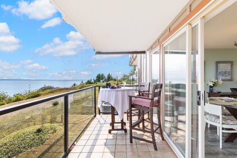 Large covered balcony with room for Grilling and eating, and hanging out. 