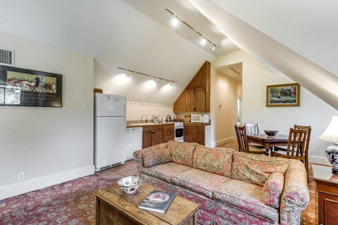 View of living/dining area showing full kitchen, including dishwasher