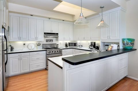 Large designer kitchen, lots of light, skylight, DCS range with large oven, and lots of counter space. It's open to the dining and living areas so the chef doesn't miss a thing!